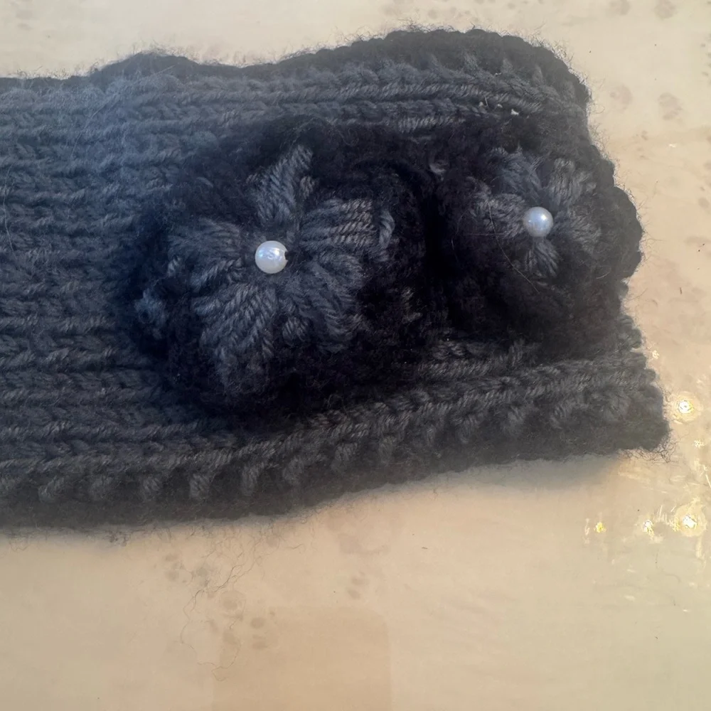 Elegant Black Knit Headband with Floral Accents